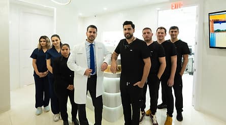 The Dream Smile Dental team standing together in the office